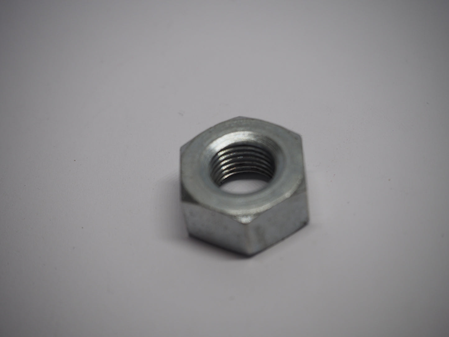 Vliegwielmoer Tomos M10x1 (215.487 / 031.044)